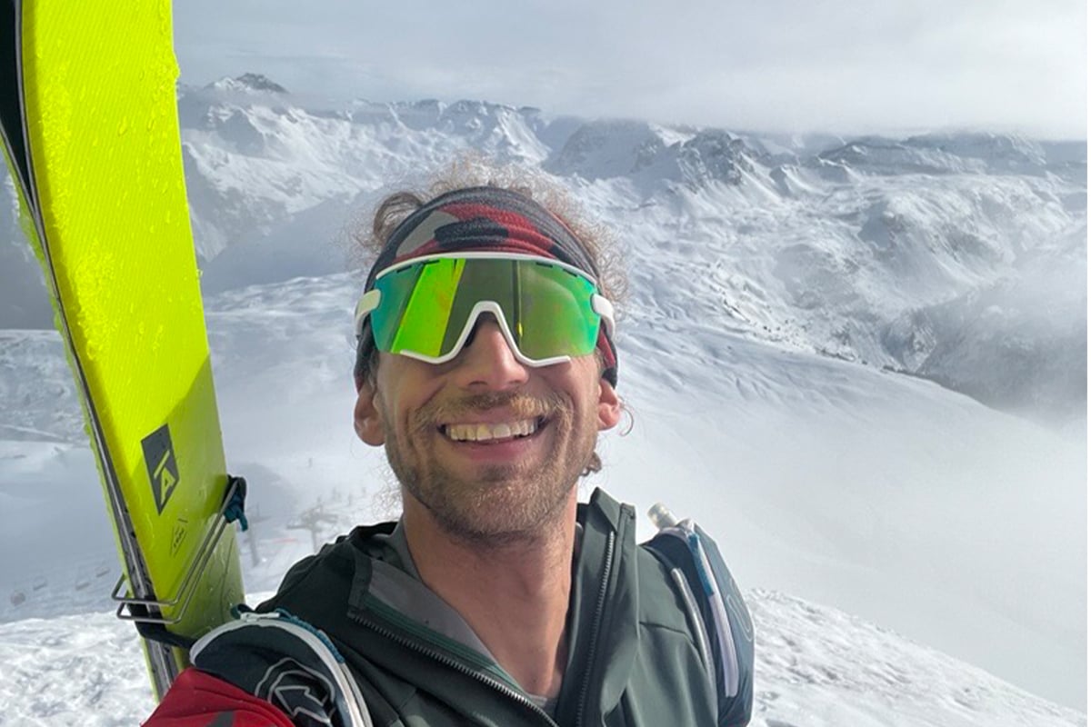 Skier with snowy mountain background